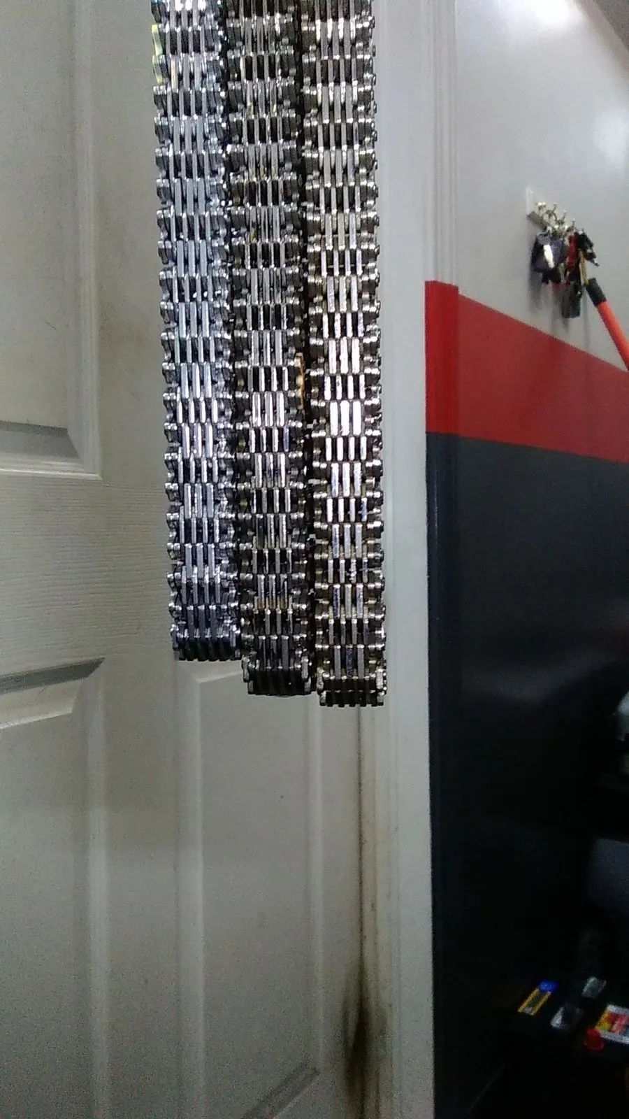 Examples of different length timing chains that have stretched over time due to wear.