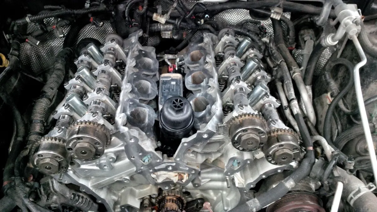 Engine block with header removed to expose timing chain gears.